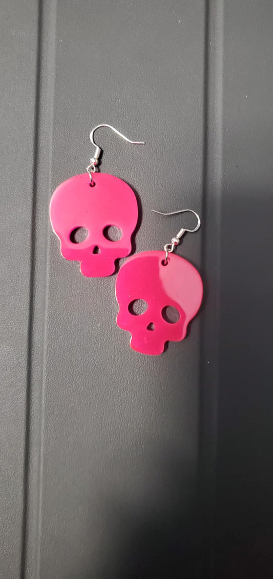 Skull earrings (pink glow)